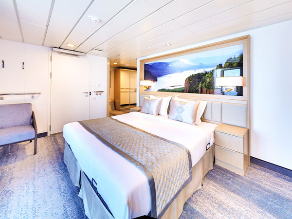 Ocean Explorer, Category DS, Deluxe Suite, View of Bed from Desk Area