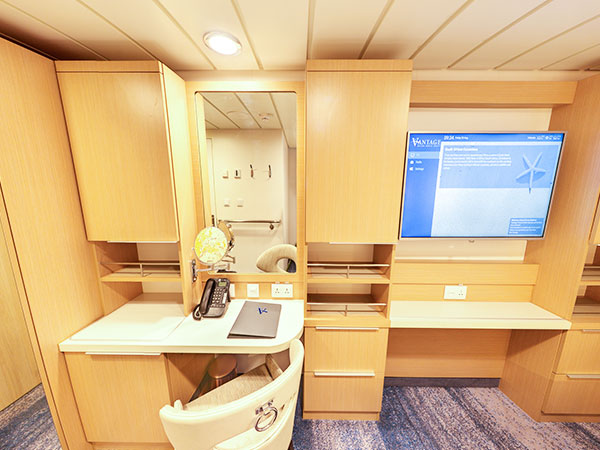 Ocean Explorer, Category SS, Studio Stateroom, Vanity and Desk Area from Bed