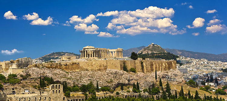 The ancient Acropolis sits high on a rock above the ancient city of Athens.